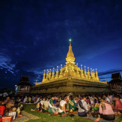 Give alms to  monks, That Luang Festival