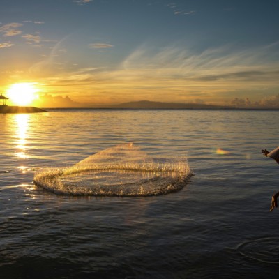 fisherman casting net