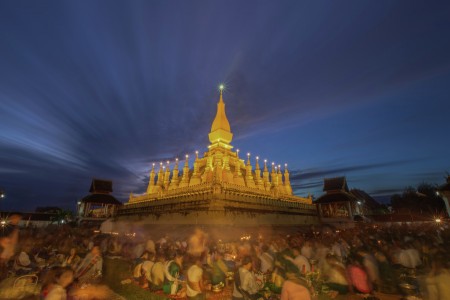 Give alms to  monks, That Luang Festival