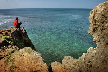 Fisherman in Kukup Beach