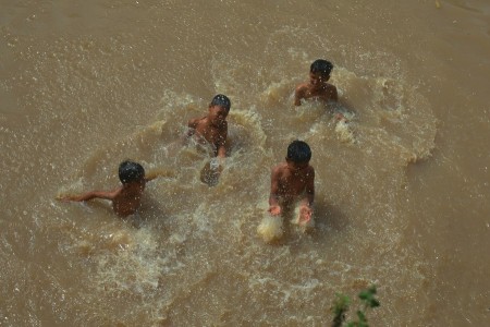 children bathing in the river