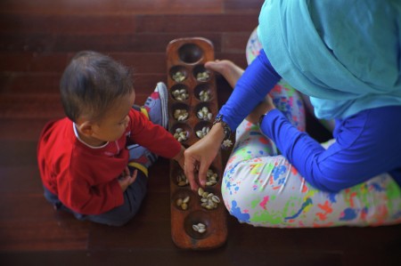 Playing Congklak