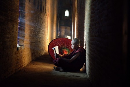 a novice monk reading a book