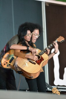 The couple guitar play on stage