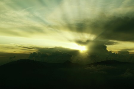 light through the clouds of the cikuray mountain