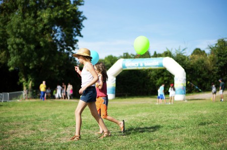 Two girls with two balloons