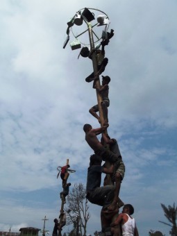 Struggling together on Panjat Pinang