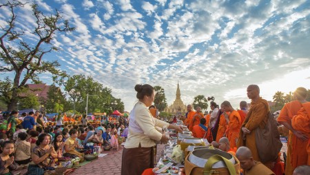 Give alms to  monks, That Luang Festival