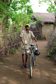 A village riding his cycle