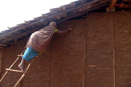 A woman trying to repair her house