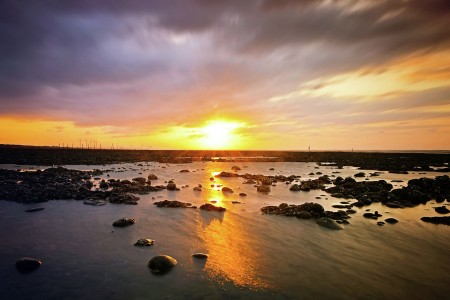 sutset pantai karang