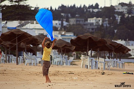 KID FLYING HIS KITE