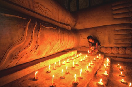 Offering Candle Light to Buddha