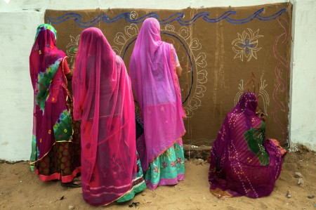 women making wall art