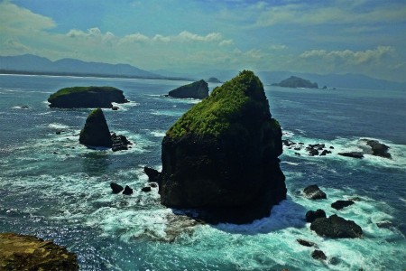 standing upright at the end of the promontory
